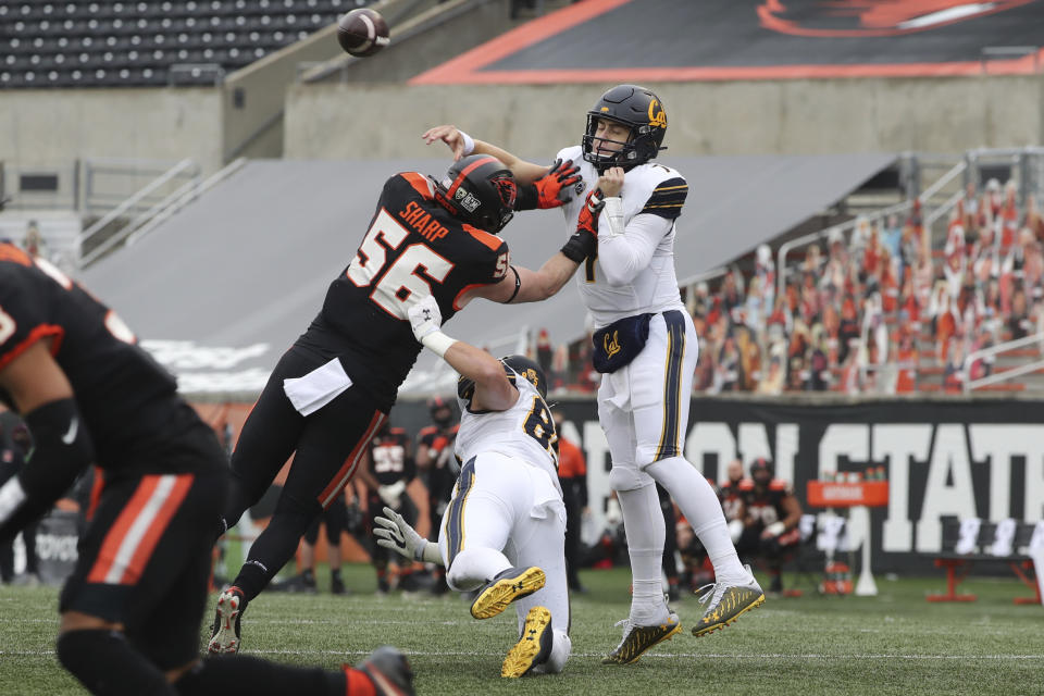 California quarterback Chase Garbers (7) throws over Oregon State outside linebacker Riley Sharp (56) during the first half of an NCAA college football game in Corvallis, Ore., Saturday, Nov. 21, 2020. (AP Photo/Amanda Loman)