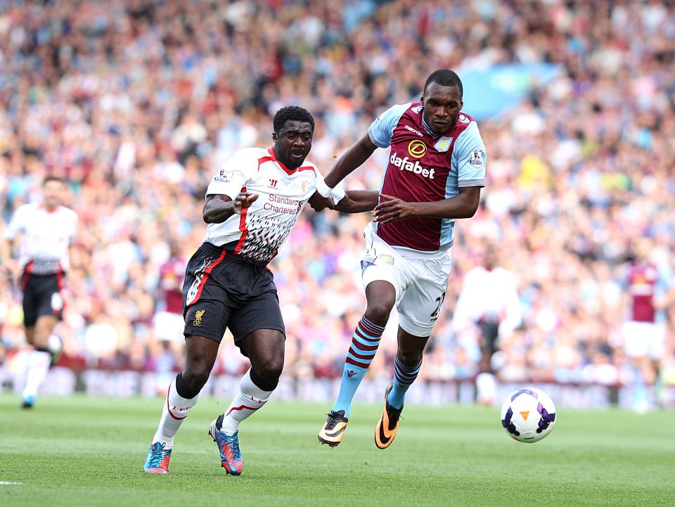 Aston Villa's Christian Benteke (right) and Liverpool's Kolo Toure (left) battle for the ball