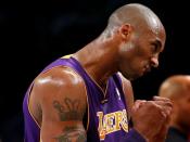 FILE PHOTO: Los Angeles Lakers' Bryant celebrates late in win over the Brooklyn Nets in their NBA basketball game in Brooklyn