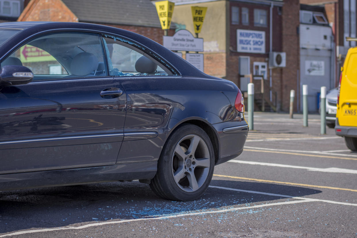 The car's window was smashed by a passer-by (SWNS)