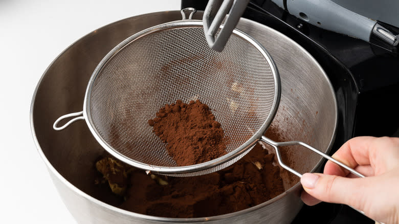 cocoa powder in mesh sieve