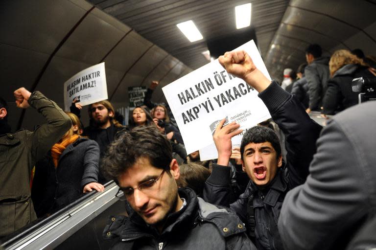 Protesters demonstrate at Taksim Underground station in Istanbul on December 31, 2013 against corruption and the goverment