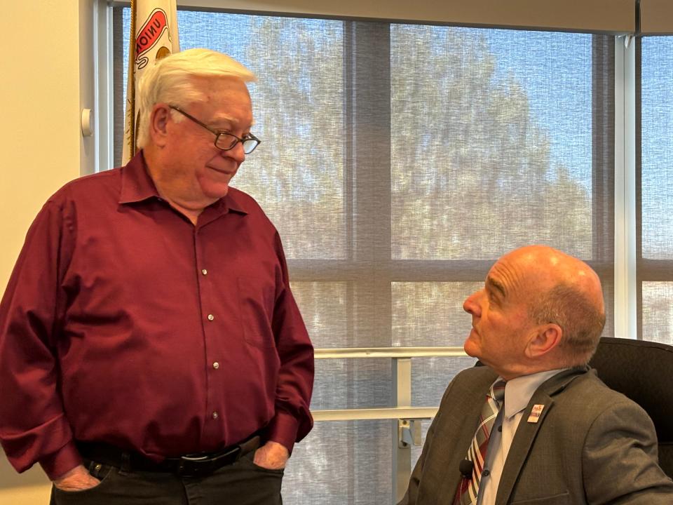 Pekin City Council members Dave Nutter (left) and John Abel chat before Monday's meeting.