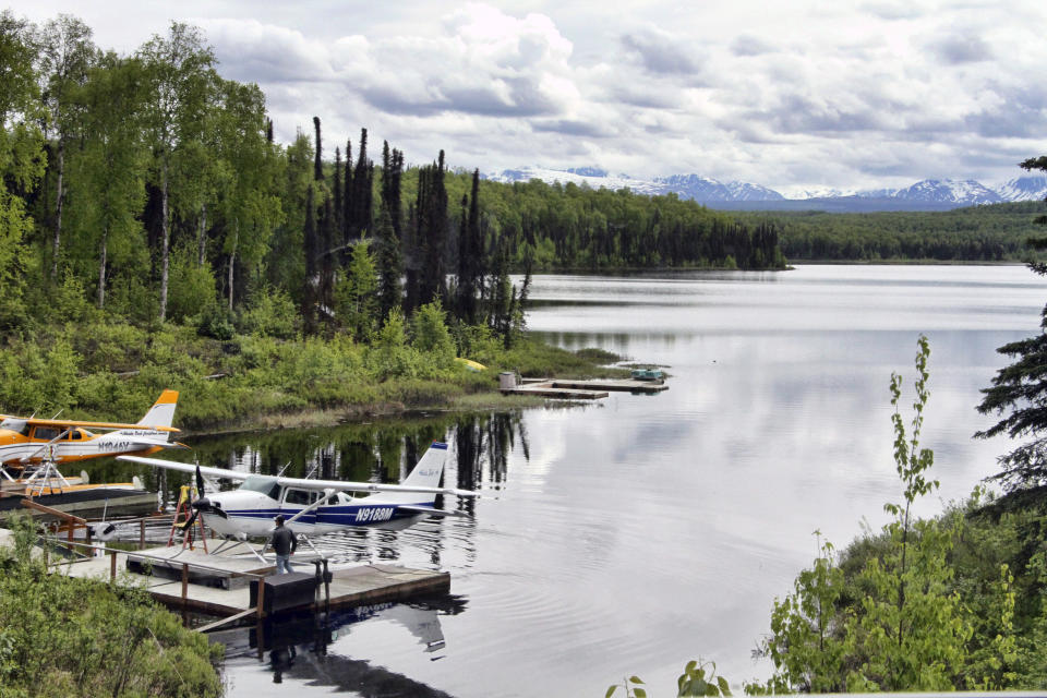 In this June 2, 2020, photo idle float planes sit at a lake near Talkeetna, Alaska. Normally a bustling tourist town, things this summer are pretty quiet in Talkeetna after most major cruise ship companies have canceled their summer tourist seasons. As a result nearly half of Alaska's annual 2.2 million visitors won't be visiting the nation's northernmost state. (AP Photo/Mark Thiessen)