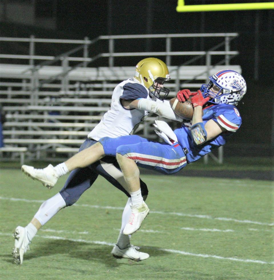 West Holmes receiver Garrett Eastep hauls a 35-yard reception to set up the game- winning touchdown. Eastep caught seven passes for 110 yards in the Knights 28-25 triumph over Tiffin Columbian Friday at Knights Stadium.