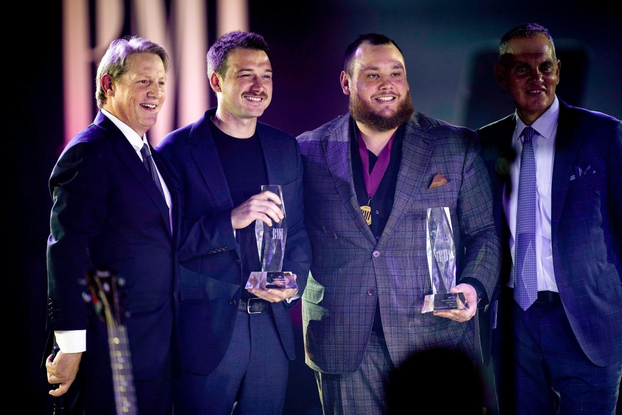 Morgan Wallen and Luke Combs receive the songwriter of the year award during the 71st annual BMI Country Awards in Nashville, Tenn., Tuesday, Nov. 7, 2023.