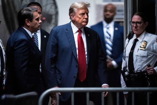 <p>Jabin Botsford/The Washington Post/Bloomberg via Getty</p> Former US President Donald Trump, center, returns from a break at Manhattan criminal court in New York, US, on Monday, April 15, 2024. Jury selection beings Monday in Trump's criminal trial where he faces 34 felony counts of falsifying business records as part of an alleged scheme to silence claims of extramarital sexual encounters during his 2016 presidential campaign.