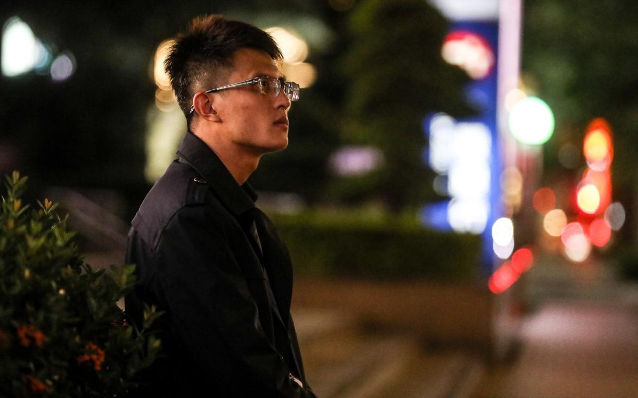 Yang Weipin, one of Taiwanese human trafficking victims from Cambodia, sitting on a street on August 26, 2022 in Taipei, Taiwan - I-HWA CHENG 