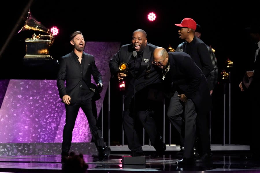 Killer Mike , center, celebrates as he accepts the award for best rap album for “Michael” during the 66th annual Grammy Awards on Sunday, Feb. 4, 2024, in Los Angeles. (AP Photo/Chris Pizzello)