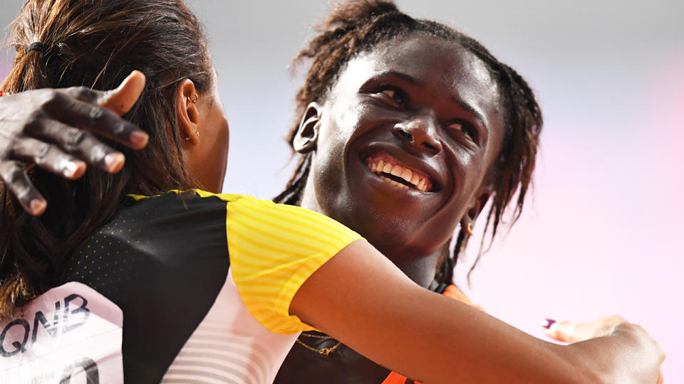 Niger's Aminatou Seyni (R) is congratulated by Germany's Tatjana Pinto after competing in the Women's 200m heats at the 2019 IAAF Athletics World Championships in Doha. Picture: JEWEL SAMAD/AFP/Getty Images