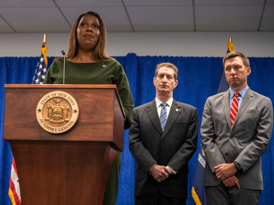New York Attorney General Letitia James announced her $250 million civil fraud suit against Donald Trump and his company with assistant attorneys general Andrew S. Amer, center, and Kevin C. Wallace, right.