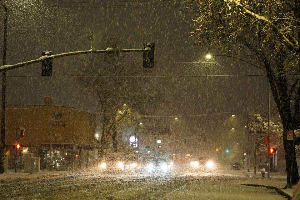 Snow falls in Redding early Friday morning, Feb. 24, 2023 as seen on North Market and Shasta streets in downtown Redding.