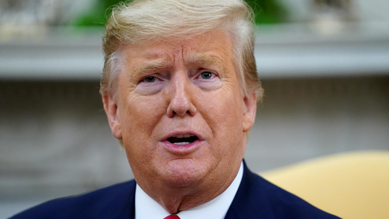 President Trump speaks to reporters in the Oval Office on Tuesday. (Kevin Lamarque/Reuters)