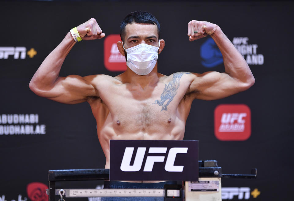 ABU DHABI, UNITED ARAB EMIRATES - JULY 14: In this handout image provided by UFC, Dan Ige poses on the scale during the UFC Fight Night weigh-in inside Flash Forum on UFC Fight Island on July 14, 2020 in Yas Island, Abu Dhabi, United Arab Emirates. (Photo by Jeff Bottari/Zuffa LLC via Getty Images)