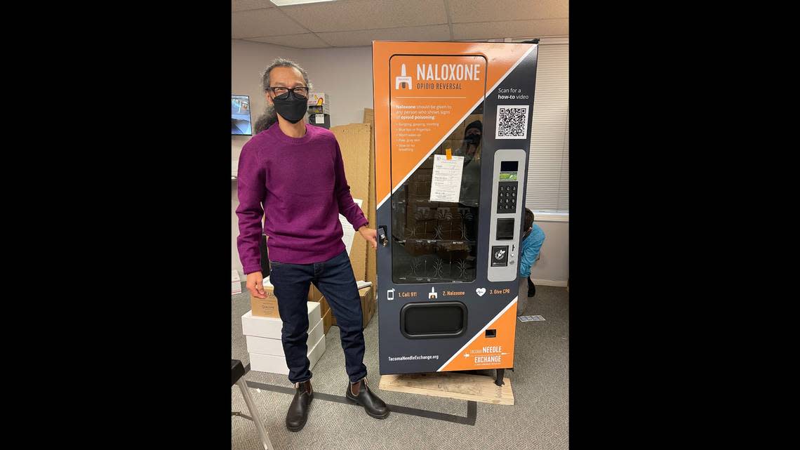 Tacoma Needle Exchange/Dave Purchase Project Executive Director Paul LaKosky stands next to one of three new naloxone vending machines. The machines will be delivered to Pierce County locations next week.