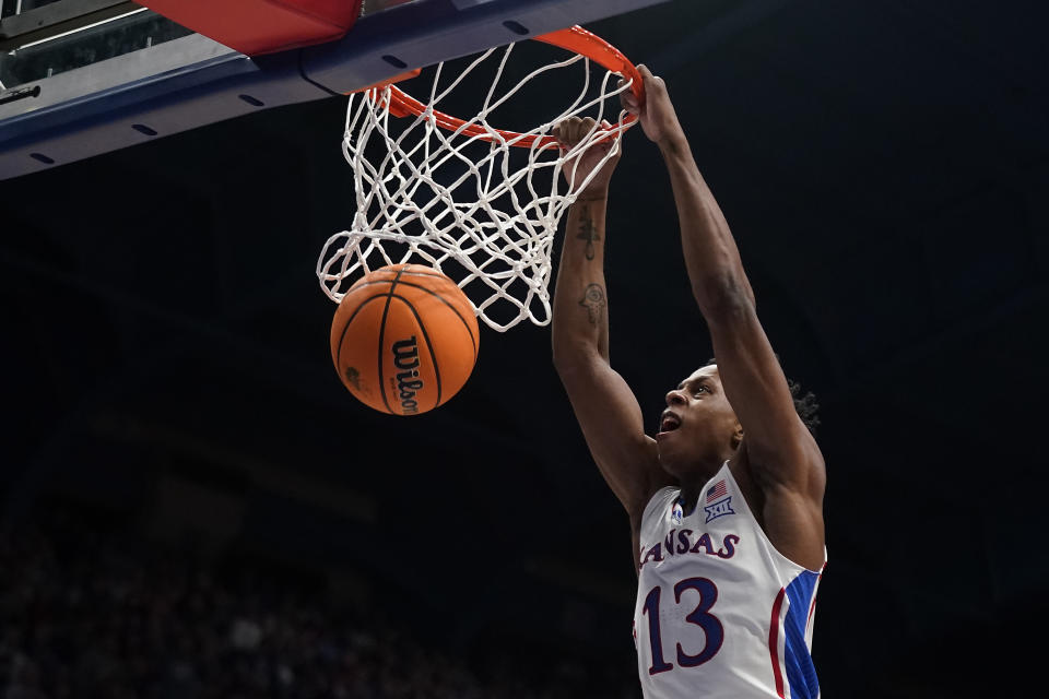 Kansas guard Elmarko Jackson dunks the ball during the first half of an NCAA college basketball game against Eastern Illinois Tuesday, Nov. 28, 2023, in Lawrence, Kan. (AP Photo/Charlie Riedel)