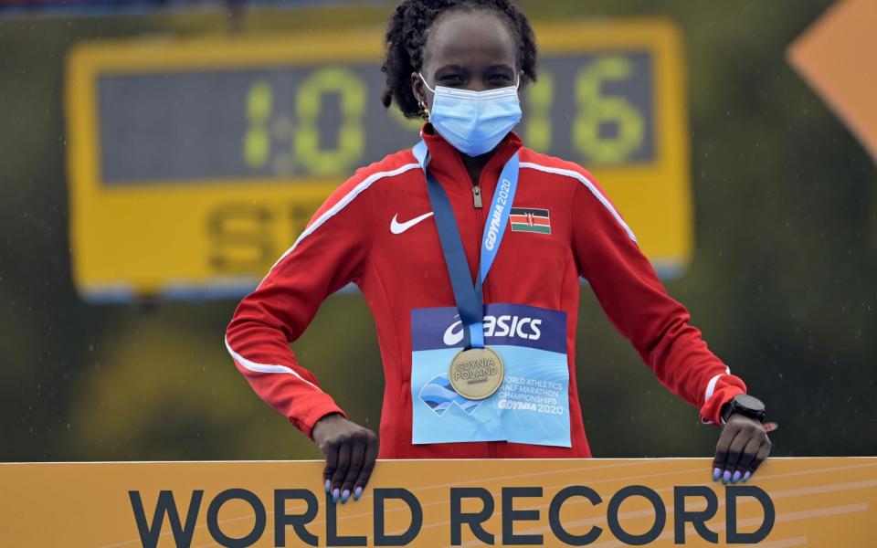 Peres Jepchirchir of Kenya celebrates on the podium after the Women's Final Run during the World Athletics Half Marathon Championships on October 17, 2020. - Adam Nurkiewicz/Getty Images