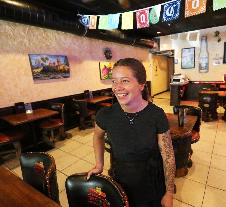 Meegan O'Connell waits for customers at Cinco de Mayo Bar & Grill in Dover Monday, July 11, 2022, saying she loves working at the the restaurant.