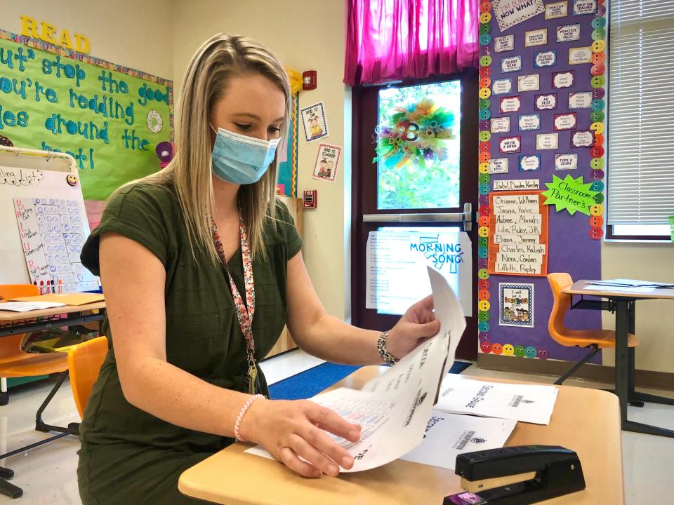 North Carolina does lag behind a lot of other states in teacher pay, including South Carolina, Tennessee and Alabama. This file photo from 2020 shows second-grade teacher Bailey Hardin preparing paperwork for the upcoming school year at Rutherfordton Elementary School in Rutherford County, North Carolina.