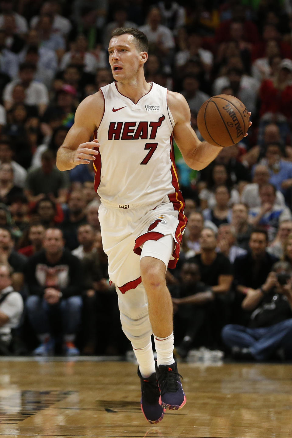 Miami Heat guard Goran Dragic (7) brings the ball upcourt against the Dallas Mavericks during the second half of an NBA basketball game, Thursday, March 28, 2019, in Miami. (AP Photo/Joel Auerbach)