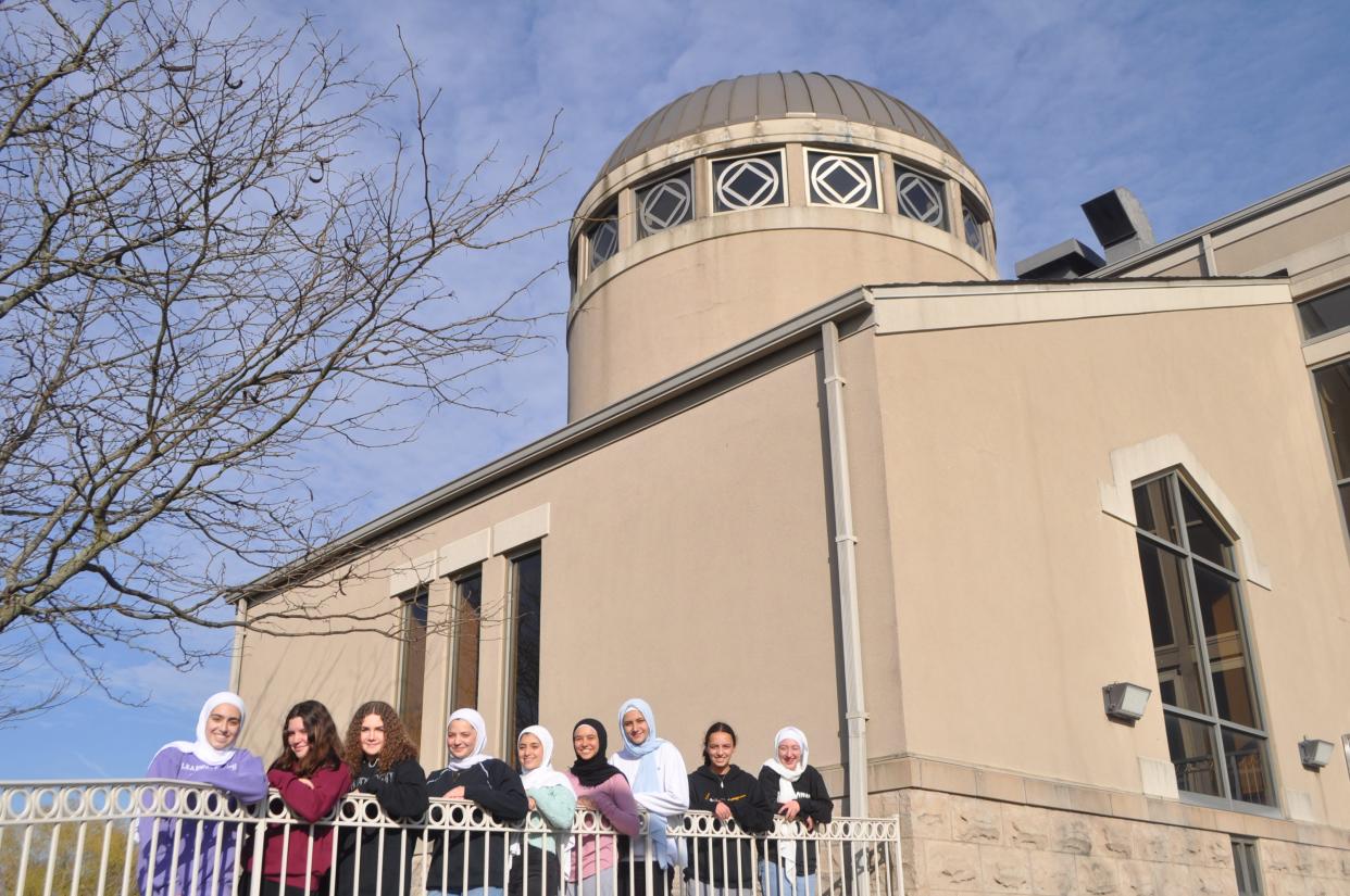 Muslim students in front of the Noor Islamic Cultural Center in July 2022.