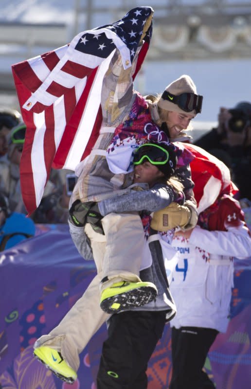 Gold medal winner Sage Kotsenburg of America celebrates with silver medalist Staale Sandbeach after the Men's Slopestyle finals at the Rosa Khutor Extreme Park during the Sochi 2014 Winter Olympics on February 8, 2014, in Krasnaya Polyana, Russia. It was the first time the event was included in the Olympics. File Photo by Kevin Dietsch/UPI