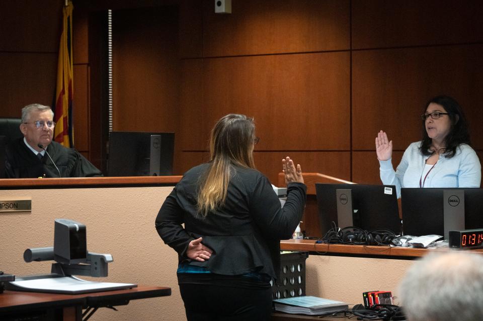 Shelby Busch (center) is sworn in during the Kari Lake election challenge trial on May 17, 2023, in Maricopa County Superior Court in Mesa, Ariz.