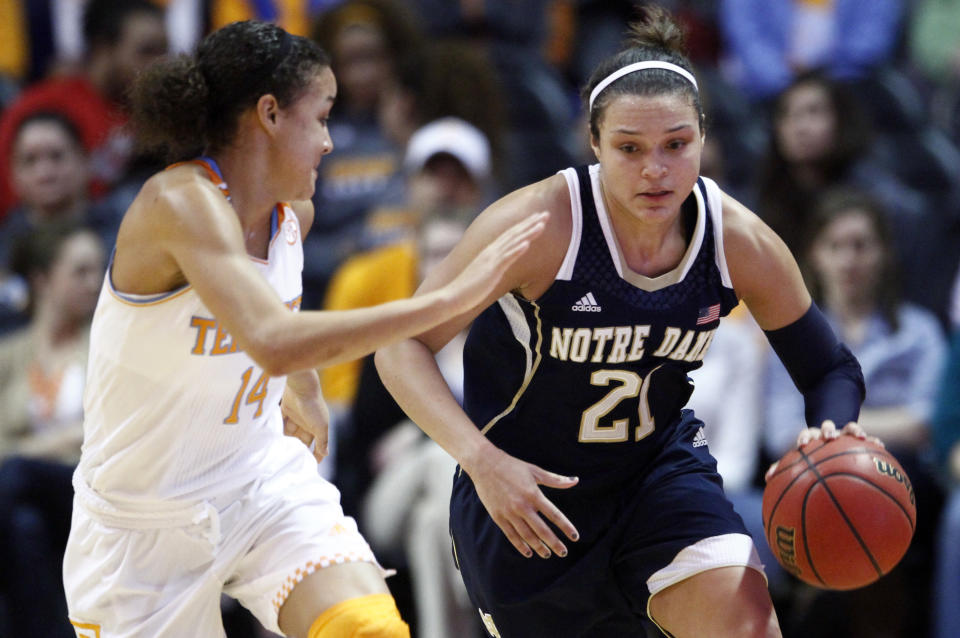 Notre Dame guard Kayla McBride (21) drives against Tennessee guard Andraya Carter (14) in the second half of an NCAA college basketball game Monday, Jan. 20, 2014, in Knoxville, Tenn. Notre Dame won 86-70. (AP Photo/Wade Payne)
