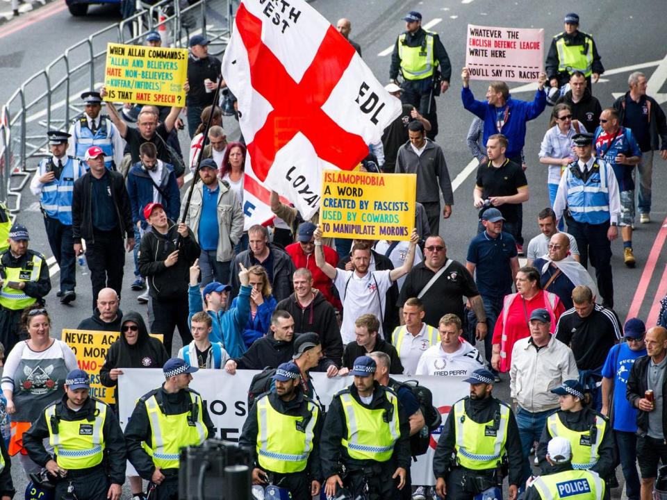 Members of the far-right anti-immigration English Defence League (EDL) march from Victoria Embankment to Charing Cross Station under heavy police guard, in Londnon, as anti-Fascist groups held a counter-demonstration nearby (EPA/PETE MACLAINE)