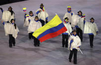 <p>Pedro Causil carries the flag of Colombia during the opening ceremony of the 2018 Winter Olympics in Pyeongchang, South Korea, Friday, Feb. 9, 2018. (AP Photo/Michael Sohn) </p>