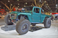 <p>The most eye-catching of the many custom builds at the Toyota booth this year is the mighty FJ Bruiser Concept, a rock-crawler based on a 1966 FJ45 pickup. With motive power from a modified version of TRD’s current NASCAR engine, the complex driveline enables the FJ to crawl at 12mph or race to <strong>165mph</strong>. There’s even an underbody track system to help it escape from high-center situations.</p>