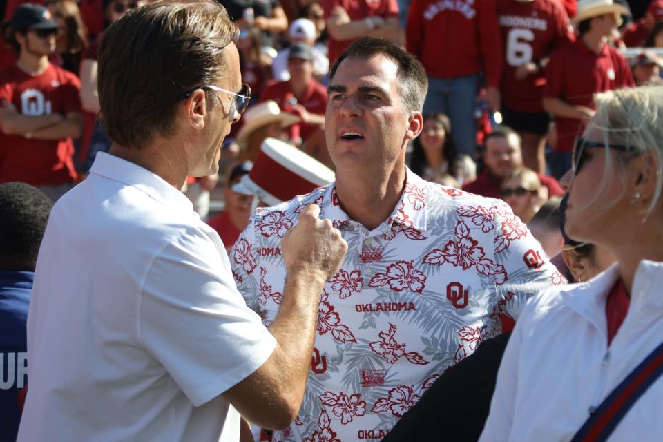 Gov. Kevin Stitt attended the Red River Rivalry college football game between the University of Oklahoma Sooners (OU) and the University of Texas (UT) Longhorns at the Cotton Bowl in Dallas last Saturday. Oklahoma won 34-30 and Stitt won a bet with Texas Gov. Greg Abbott.