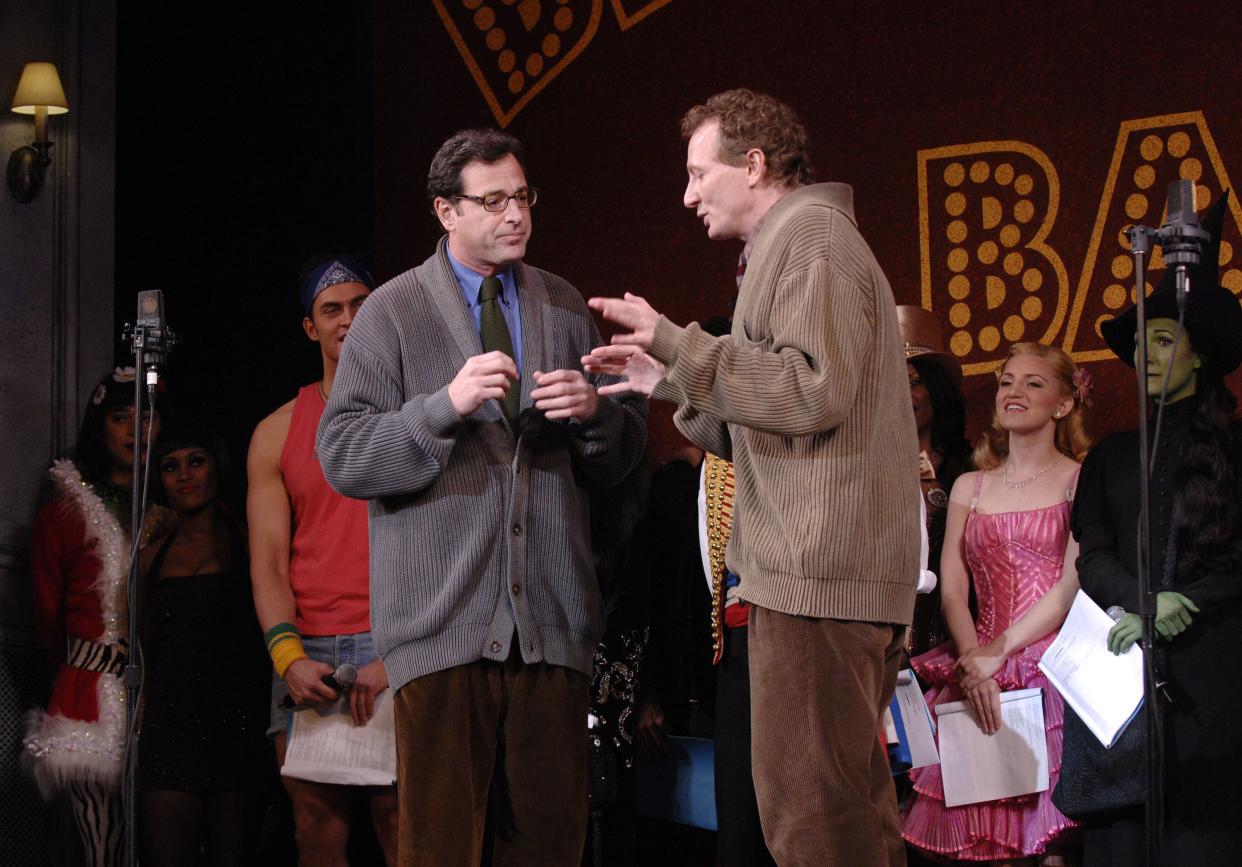 Tony award-winner Bob Martin, right, interacts on stage with Bob Saget, left, during a free performance as cast members from dozens of Broadway shows celebrate the return to the theater following an end to the 19-day strike by stagehands and producers on Friday, Nov. 30, 2007, in New York.