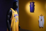 NBA basketball jerseys, including one worn by Kobe Bryant during game 1 the 2009 Finals, left, are displayed during a preview at Sotheby's in New York, Thursday, April 4, 2024. These items and other sports memorabilia are up for auction at Sotheby's currently. (AP Photo/Seth Wenig)