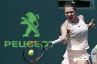 Mar 24, 2018; Key Biscayne, FL, USA; Simona Halep of Romania hits a forehand against Agnieszka Radwanska of Poland (not pictured) on day five of the Miami Open at Tennis Center at Crandon Park. Radwanska won 3-6, 6-2, 6-3. Mandatory Credit: Geoff Burke-USA TODAY Sports