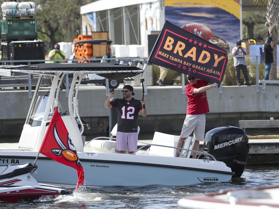 Tampa Bay Buccaneers fans follow a boat parade celebrating their Super Bowl 55 victory over the Kansas City Chiefs in Tampa, Fla., Wednesday, Feb. 10, 2021. (Dirk Shadd/Tampa Bay Times via AP)