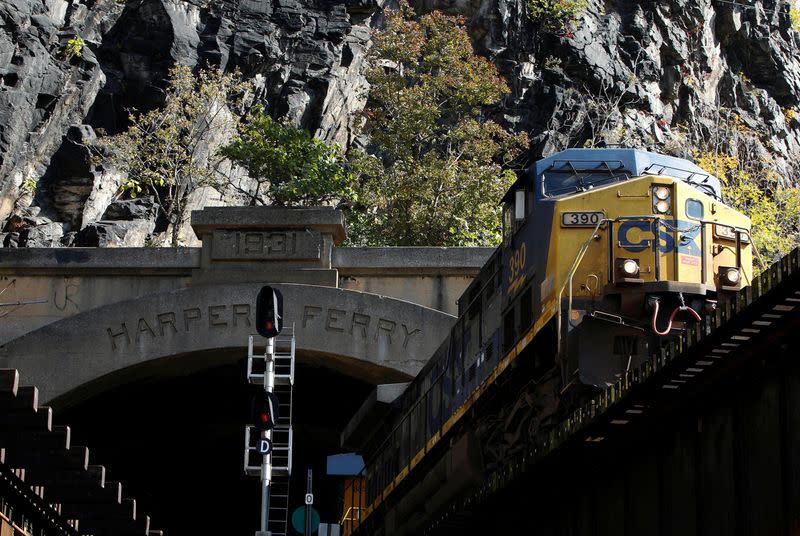 FILE PHOTO: A CSX freight train heads westbound out of a tunnel into Harpers Ferry, West Virginia