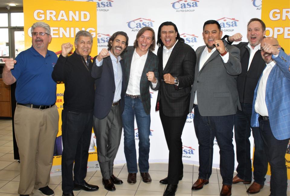 Casa Auto Group co-owners Luke Lowenfield, third from left, and his brother Ronnie Lowenfield celebrate with other Casa officials Wednesday at the grand opening of the four Alamogordo, New Mexico, dealerships Casa purchased from Desert Sun Motors. The celebration was at the newly renamed Casa Toyota dealership.