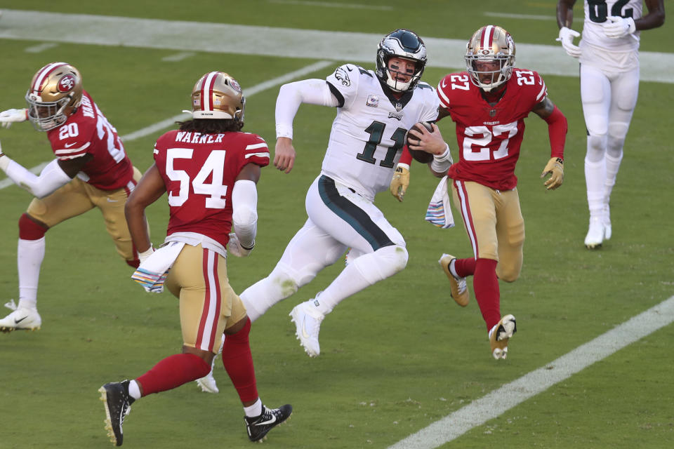 Philadelphia Eagles quarterback Carson Wentz (11) runs for a touchdown against the San Francisco 49ers during the first half of an NFL football game in Santa Clara, Calif., Sunday, Oct. 4, 2020. (AP Photo/Jed Jacobsohn)