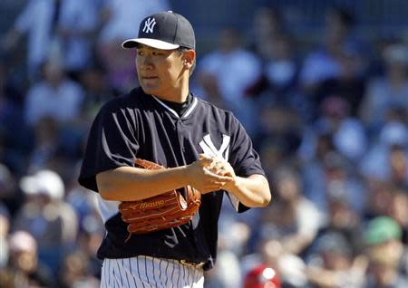 Mar 1, 2014; Tampa, FL, USA; New York Yankees pitcher Masahiro Tanaka (19) looks on during the sixth inning against the Philadelphia Phillies at George M. Steinbrenner Field. Kim Klement-USA TODAY Sports