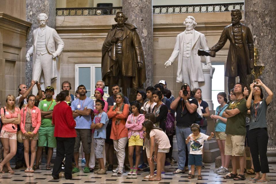 Visitors gather for a tour in Statuary Hall at the Capitol in Washington, Tuesday, July 2, 2013. The National Statuary Hall Collection in the Capitol displays two statues from each state to honor the nation’s founders, leaders and legends. (AP Photo/J. Scott Applewhite)