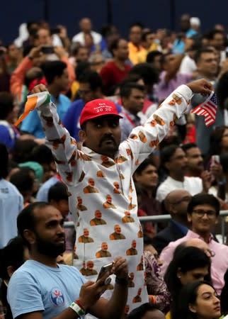 An attendee gestures during the "Howdy Modi" event in Houston