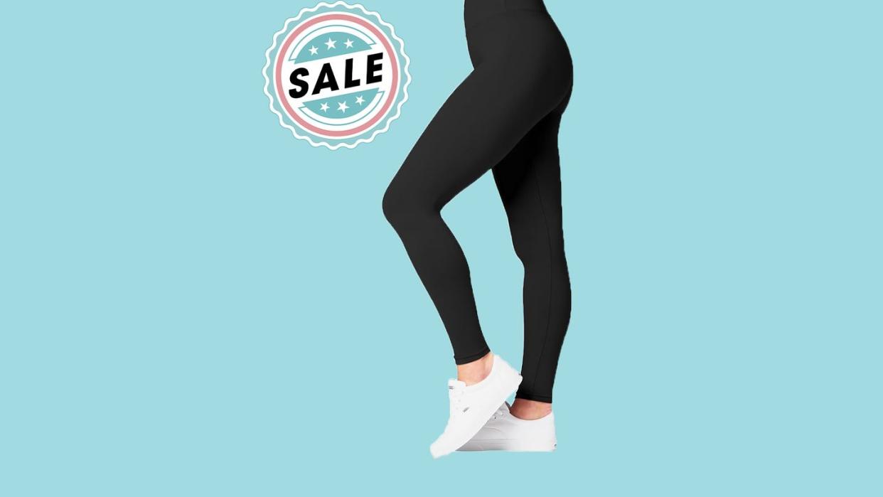 legs wearing satina high waisted leggings next to a sale sign in front of a blue background