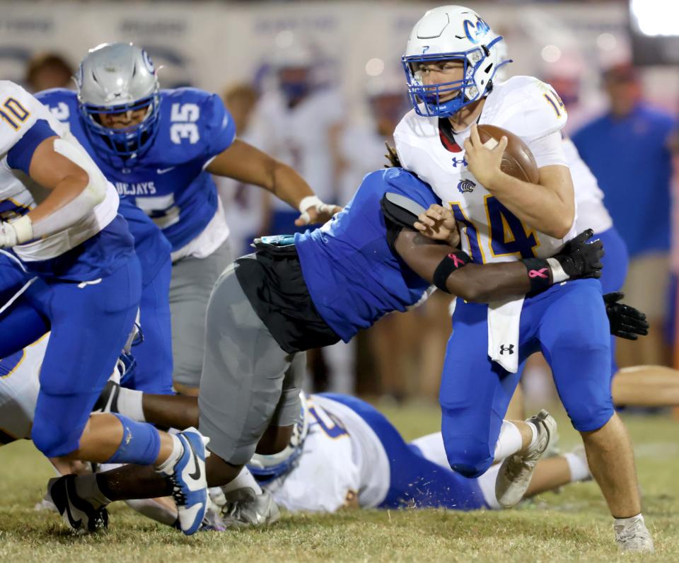 Piedmont's Joshua Mars is tackled by Guthrie's Dae'Lontae Glover during the high school football game between Guthrie and Piedmont at Guthrie, Okla., Friday, Sept. 29, 2023.