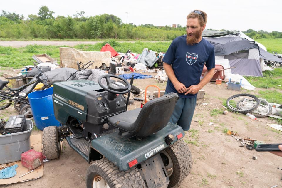 Cody Bartley talks about the riding lawnmower he uses to pull a trailer to haul scrap metal to make money.