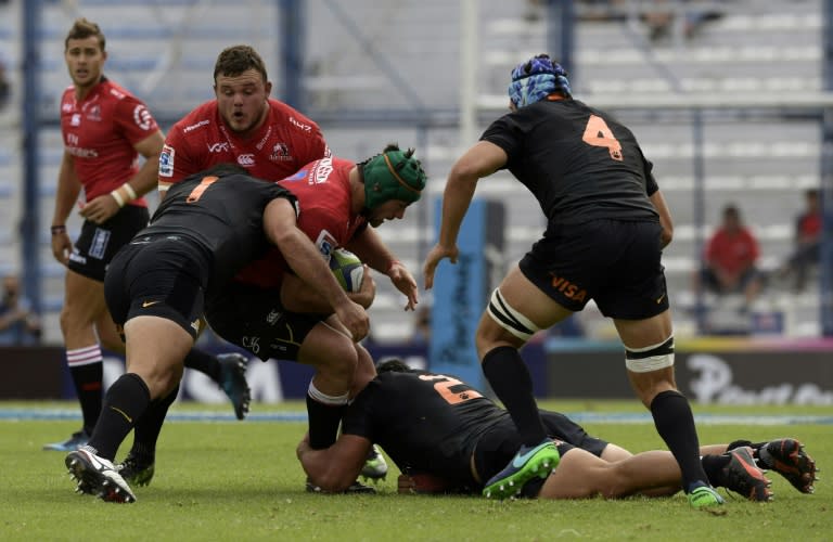 South Africa's Robbie Coetzee (C) is tackled by Argentina's Agustin Creevy (2-R) and prop Santiago Garcia Botta during their match in Buenos Aires on March 11, 2017