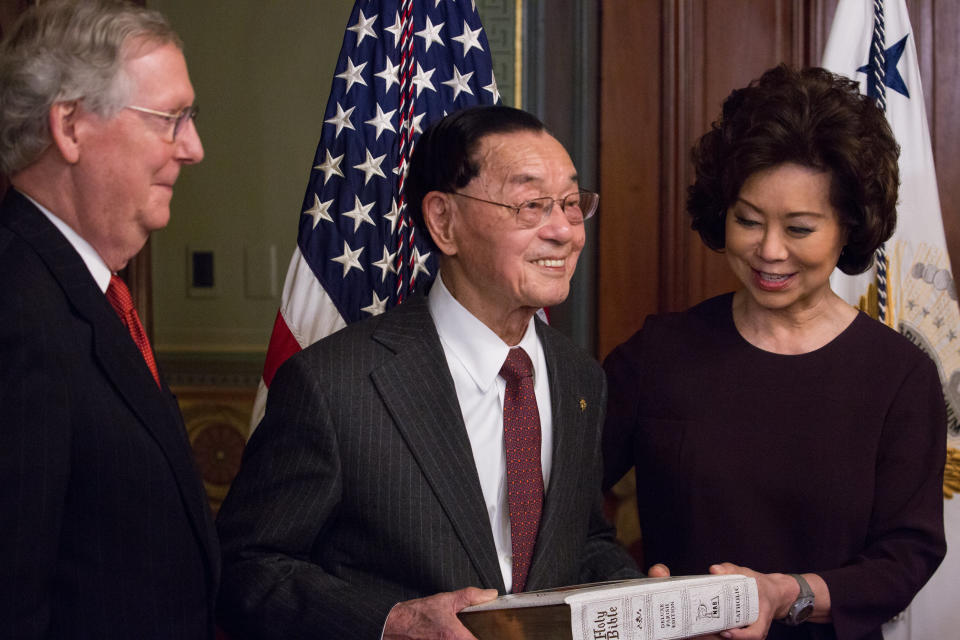 Elaine Chao is seen being sworn in as the&nbsp;transportation secretary with her father, James Chao, holding a Bible. Her husband,&nbsp;Senate Majority Leader&nbsp;Mitch McConnell, bears witness. (Photo: NurPhoto via Getty Images)