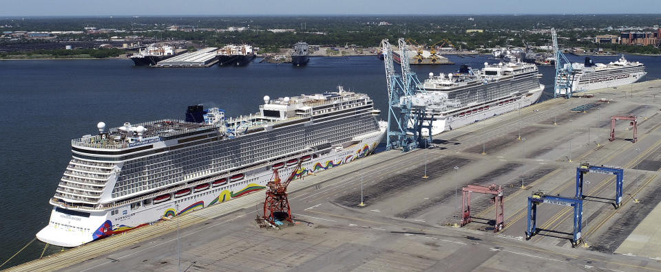 FILE - In this May 4, 2020 file photo, Norwegian cruise ships are docked at Portsmouth Marine Terminal in Portsmouth, Va. A federal judge on Sunday night, Aug. 8, 2021, granted Norwegian Cruise Line’s request to temporarily block a Florida law banning cruise companies from asking passengers for proof of coronavirus vaccination before they board a ship. U.S. District Judge Kathleen Williams granted the preliminary injunction in a lawsuit challenging the state’s “vaccine passport” ban, which was signed into law in May by Republican Gov. Ron DeSantis. (Stephen M. Katz/The Virginian-Pilot via AP, File)