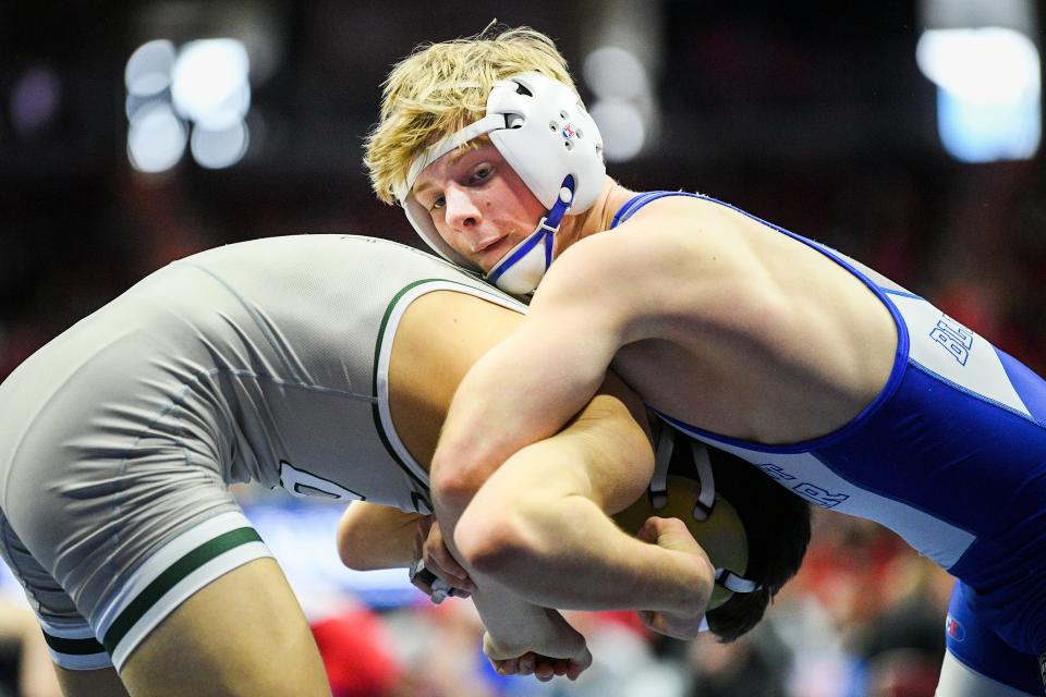 Bondurant-Farrar's Maximus Riggins, right, took fifth at the 16U men's freestyle national championships at 126 pounds.