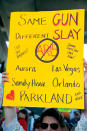 <p>Protesters hold signs at a rally for gun control at the Broward County Federal Courthouse in Fort Lauderdale, Florida on Feb. 17, 2018. (Photo: Rhona Wise/AFP/Getty Images) </p>